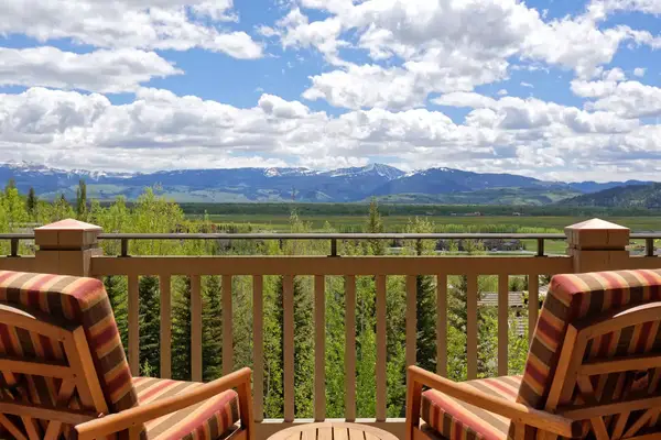View from Four Seasons Jackson Hole terrace with two chairs during summer