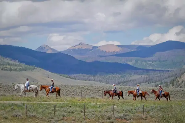 Family riding horses