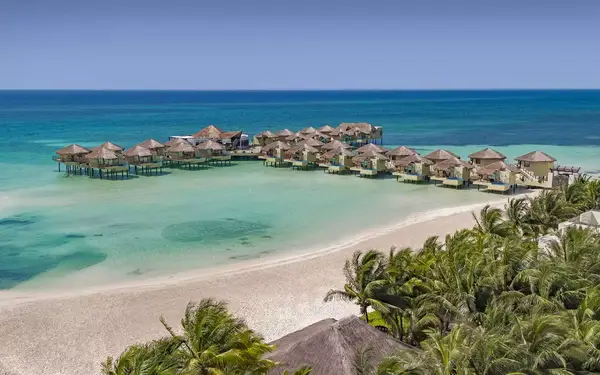 Overwater Palafitos bungalows at El Dorado Maroma resort in Mexico