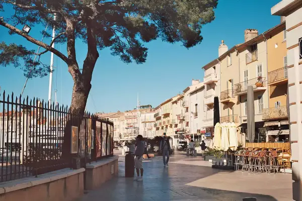 A view of café-lined Rue Henri Seillon, near the harbor in St Tropez, France