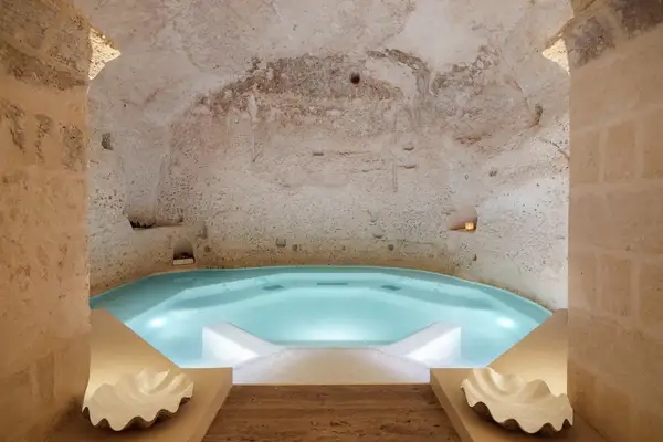 Indoor pool inside a stone cave-like structure
