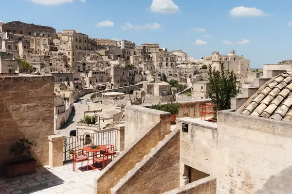 A terrace and view of historical stone buildings in an Italian town