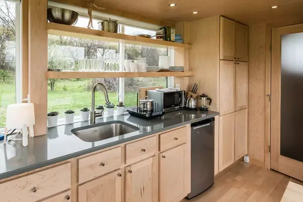 The kitchen inside The Glass House: A Hudson Valley Tiny Home Escape