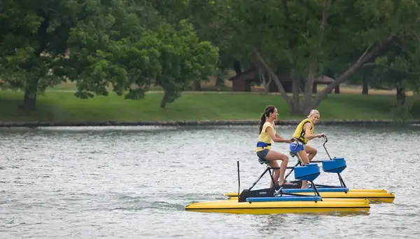 Women riding Hobie Pedal Boards at Lake Austin Spa in Texas.