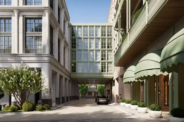 Exterior building view with a glass bridge connecting two sections of the Four Seasons Hotel in Charleston