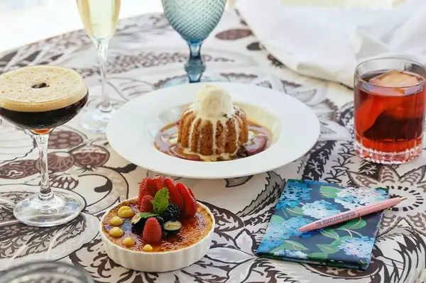 An arrangement of desserts and drinks on a decorated table