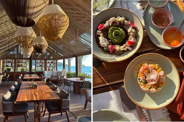 Dining setting at a restaurant with wooden furniture, dishes of food including ceviche and appetizers displayed on a table
