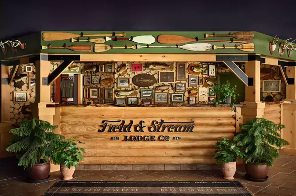 Front desk of Field & Stream Lodge Co with decorative elements and wooden ambiance