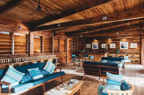 Interior of a lounge at Bitter End Yacht Club with wooden design and seating