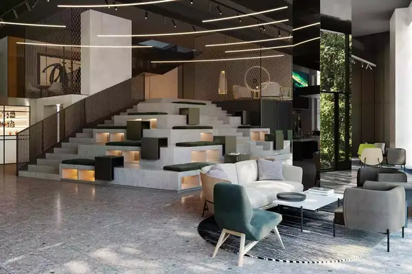 A modern hotel lobby featuring tiered seating, tables, and seating areas arranged in an open, contemporary design