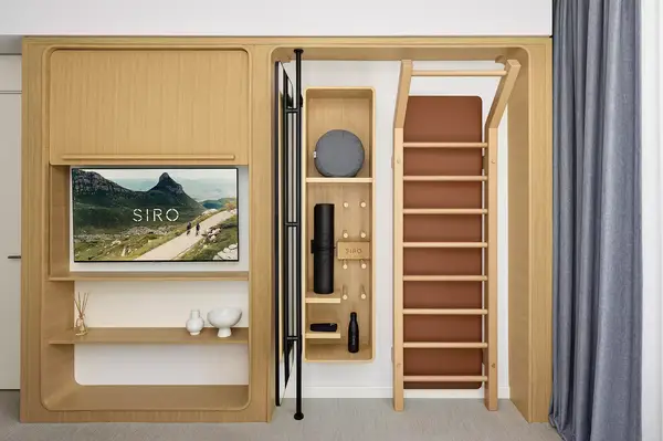 Fitness and relaxation suite with a recovery cabinet, ladder, shelves, and a TV