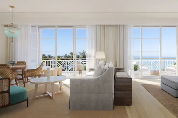 Elegant living room with sea view, large windows, and modern furnishings