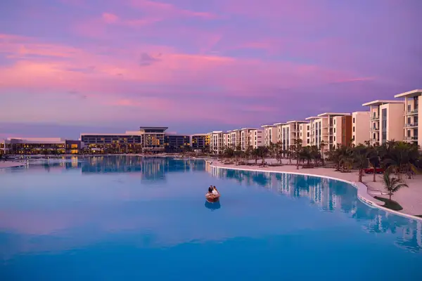 A couple in a boat at sunset