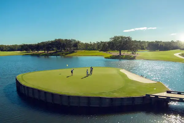 A group of people playing golf on an island