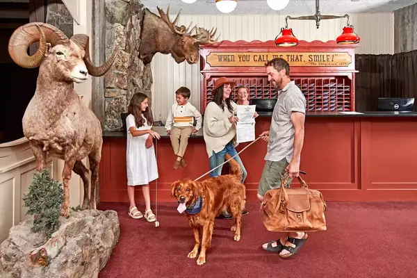 A family checking in at The Virginian Lodge
