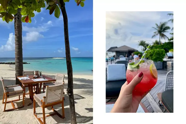 A dining table on the beach under palm trees and a hand holding a pink cocktail