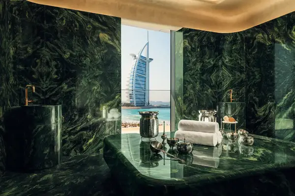 Luxury spa room with a view of the Burj Al Arab in the background