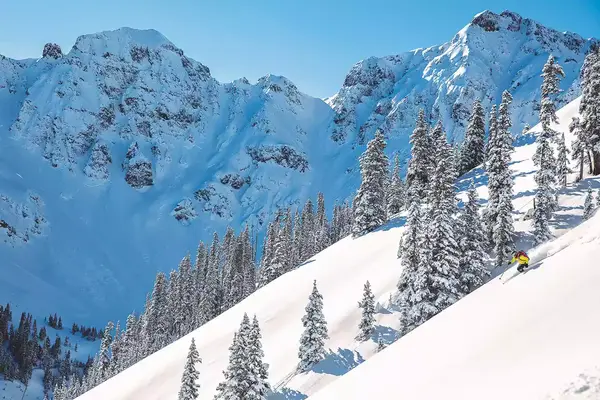 A man skiing down Silverton Mountain