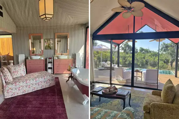 Luxury tent with an elegant bedroom and a living area opening to a deck with outdoor scenery