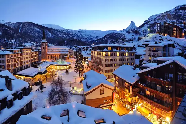 The village at Zermatt lit up at dusk
