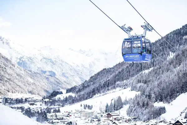 Lift ascending mountain above town of St. Anton am Arlberg