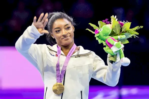 simone biles with gold medal at artistic gymnastics world championships antwerp 2023