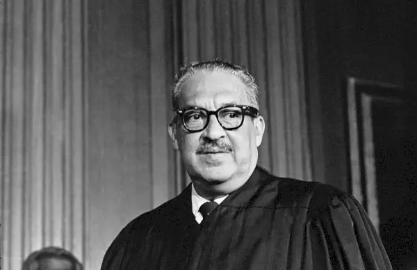 thurgood marshall, the great grandson of a slave, takes his seat as the first black member of the united states supreme court