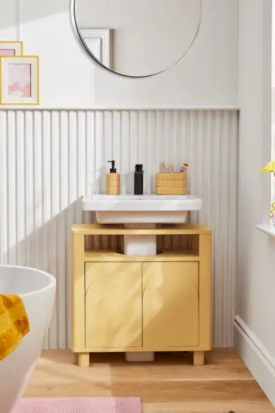 a small white shelf with objects on it