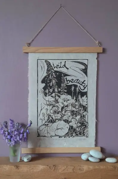 small cactus in handmade ceramic pot, in the background a rush basket