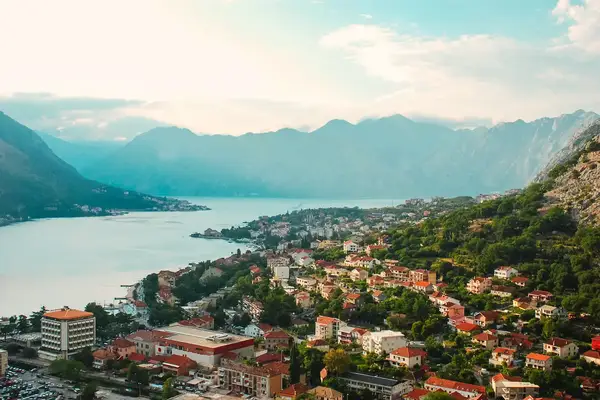 Aerial view of Kotor featuring its bay and the surrounding mountains showcasing the towns layout and geography