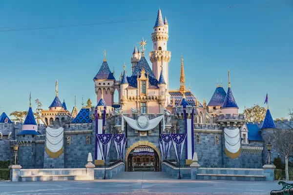 Exterior facade of the Disneyland castle decorated for the Disney100 Celebration