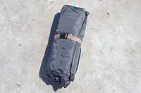 WhiteFang 3-Person Beach Tent folded up on the beach