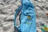 beachBUB All-In-One Beach Umbrella System carrying case on sand