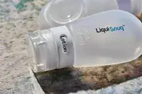 Closeup Liquisnugs Premium Leak-Proof Silicone Travel Bottles on granite counter