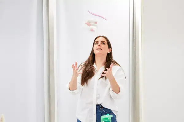 Person throwing the Vitog Travel Bottles Kit in the air