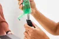 Person filling the Matador Toiletry Bags with product