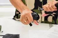 Person squeezing the Matador Toiletry Bags