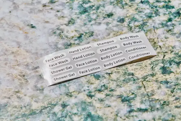 The labels for the INSFIT TSA Carry-on Approved Containers