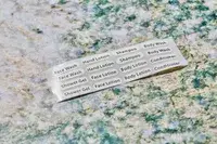 The labels for the INSFIT TSA Carry-on Approved Containers