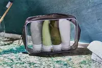 The INSFIT TSA Carry-on Approved Containers in a zip pounch on a counter