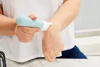 Person applying product from a Mrsdry Travel Bottle