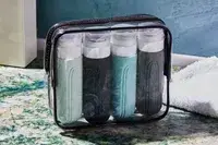 Mrsdry Travel Bottles sitting on a bathroom counter