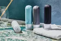 Mrsdry Travel Bottles sitting on a bathroom counter