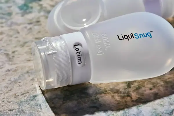 Closeup Liquisnugs Premium Leak-Proof Silicone Travel Bottles on granite counter