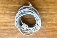 Tumaber 3-Pack Apple 10-foot Lightning to USB Cords on a wood surface
