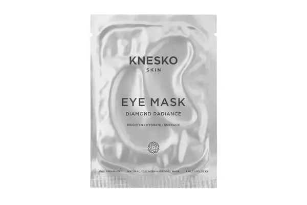 Person wearing a White+Warren Cashmere Travel Wrap around their neck over a winter coat