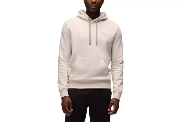 Person wears a Spanx AirEssentials Half Zip