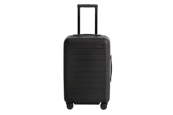 A person grabbing the Ostrich Pillow Go Neck Pillow from their bag