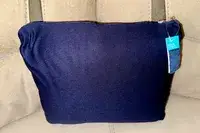 Travelrest 4-in-1 Travel Blanket carrying pouch displayed on a gray surface