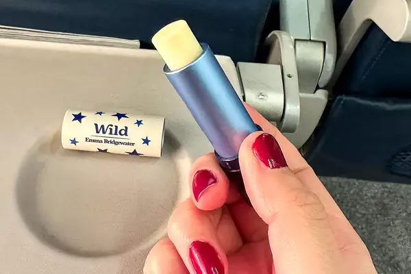 A person holding the Wild Lip Balm